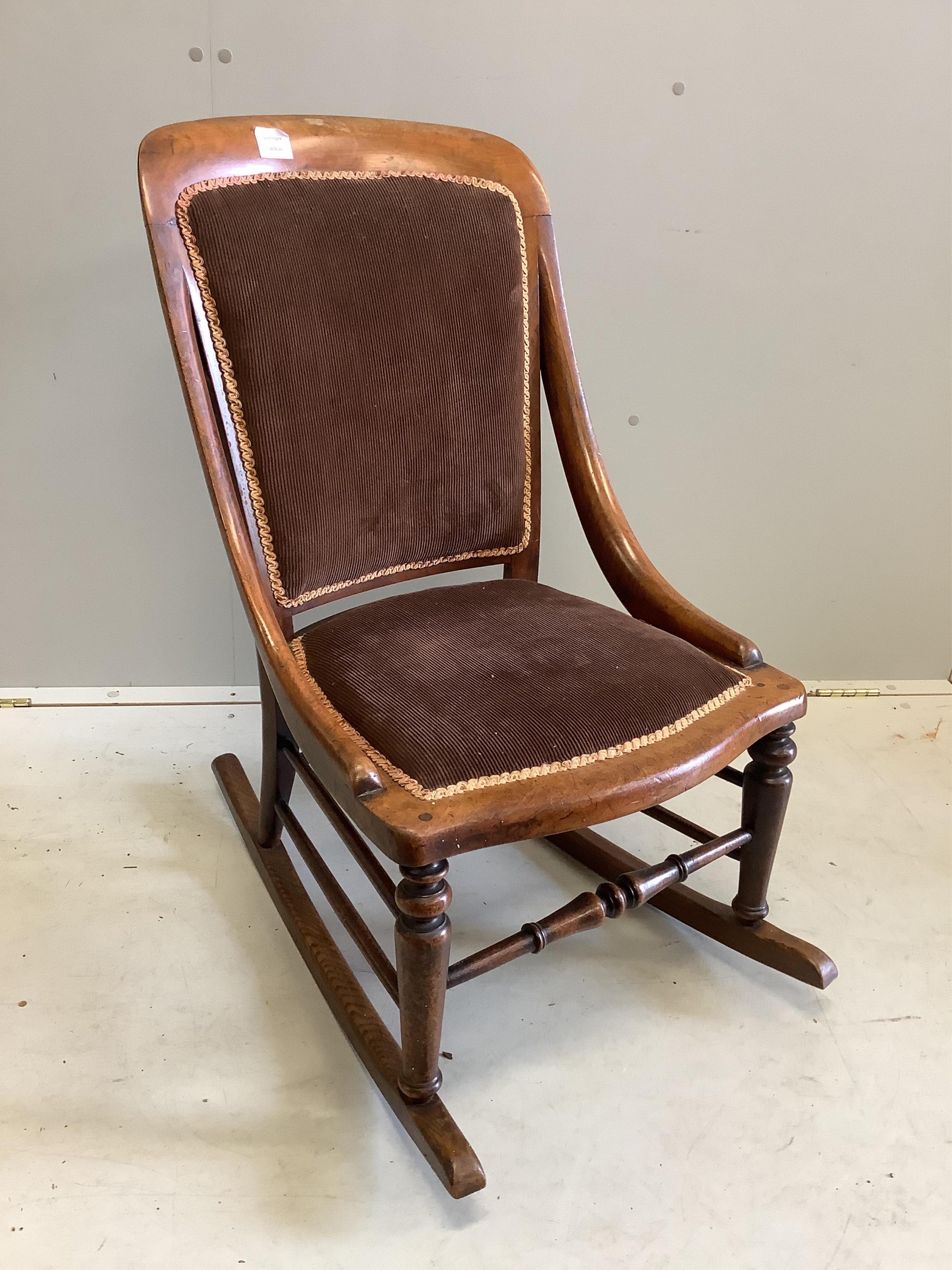 A Victorian mahogany rocking chair, width 49cm, depth 50cm, height 85cm. Condition - fair